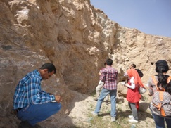 Group of student learning how to measure the strike and dip of the beds